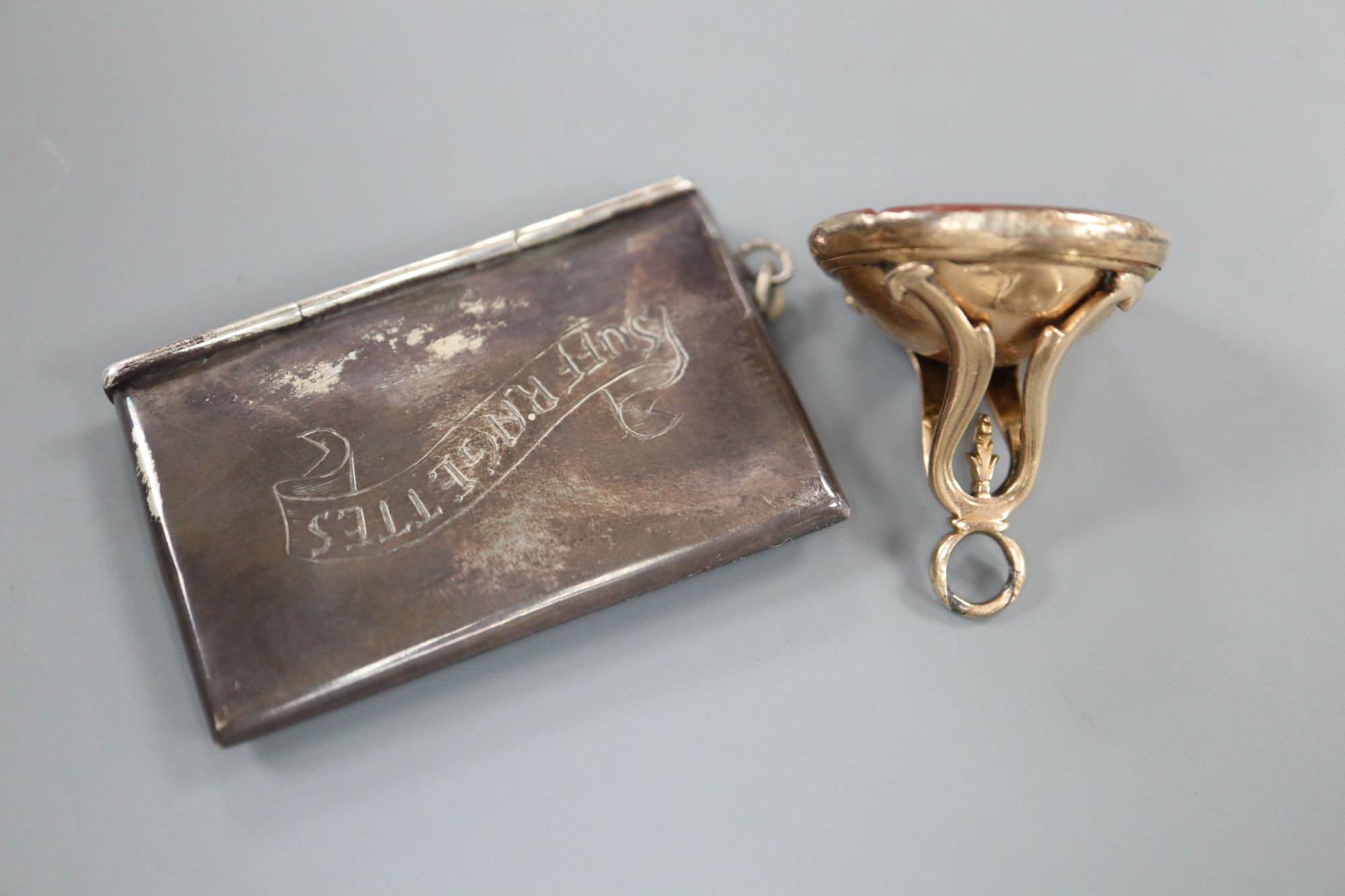 A 19th century yellow metal and carnelian set intaglio fob seal(a.f.) and an Edwardian silver double stamp case